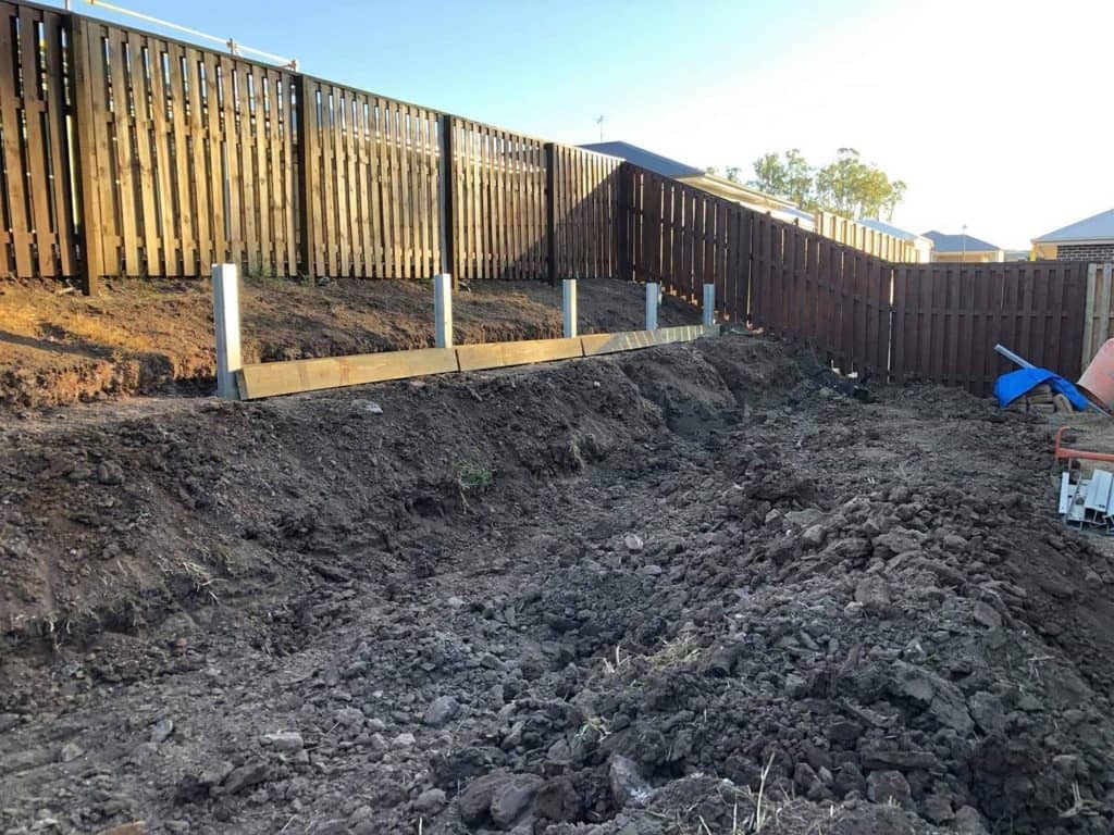 Steel Posts in Concrete Footings: A Foundation for Landscape Transformation in Forest Lake