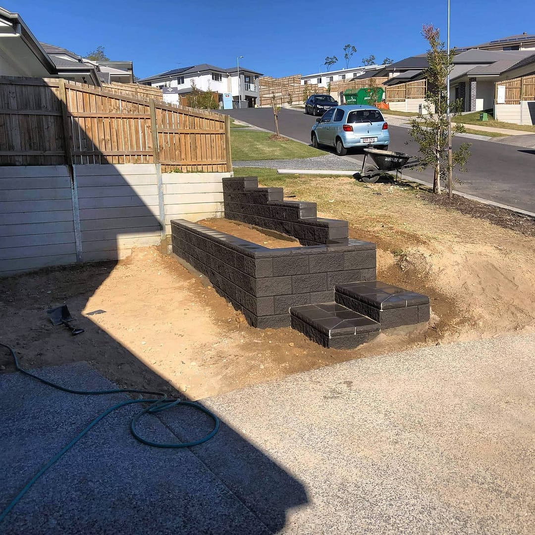 Double tier retaining wall and steps.