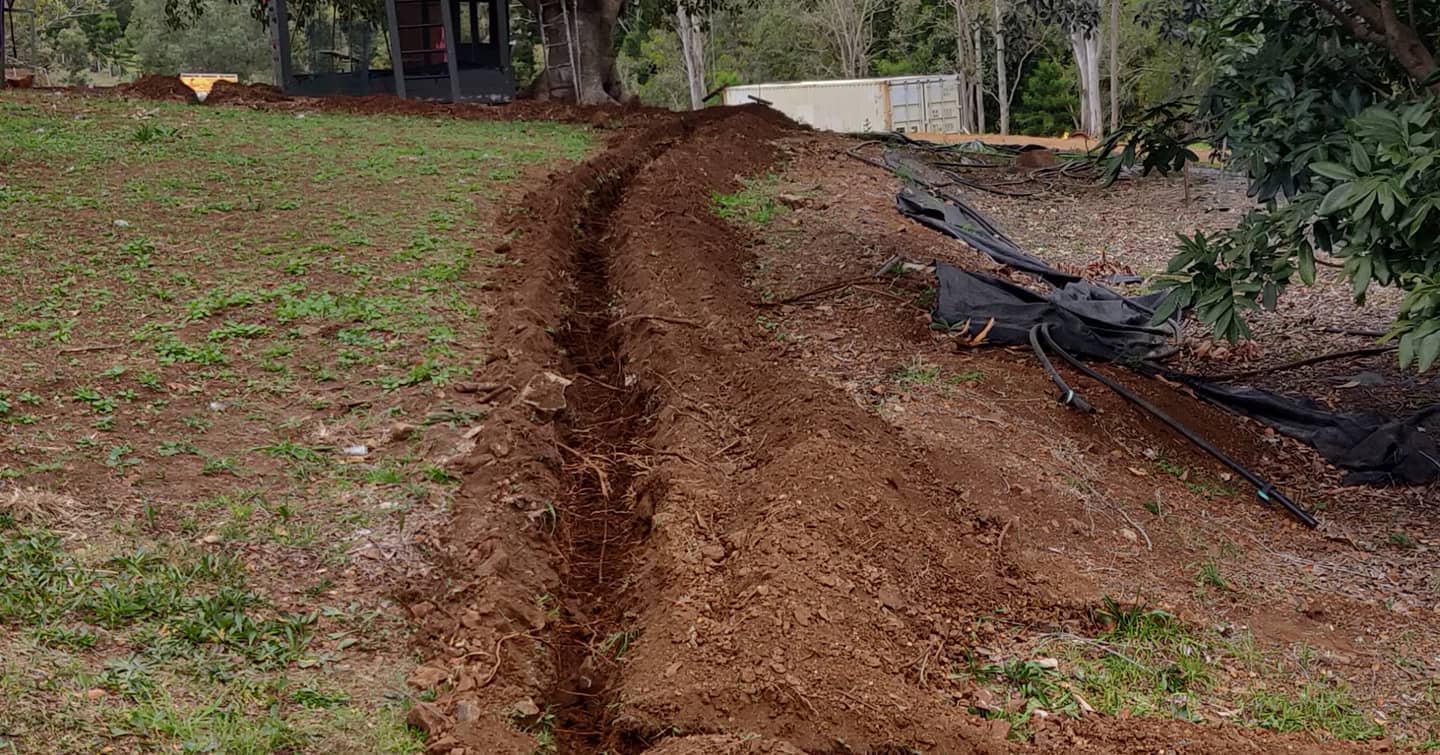 Trenching in some electrical cable in toowong