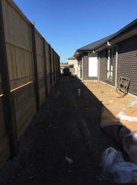 Elevated and leveled this houses surroundings in preparation for astro turf with a neat deep edge for garden installation