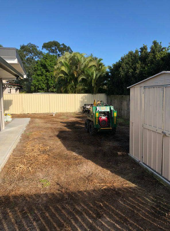 Ian Rogers hard at work and still smiling cleared out the whole backyard ready for some landscape renovations