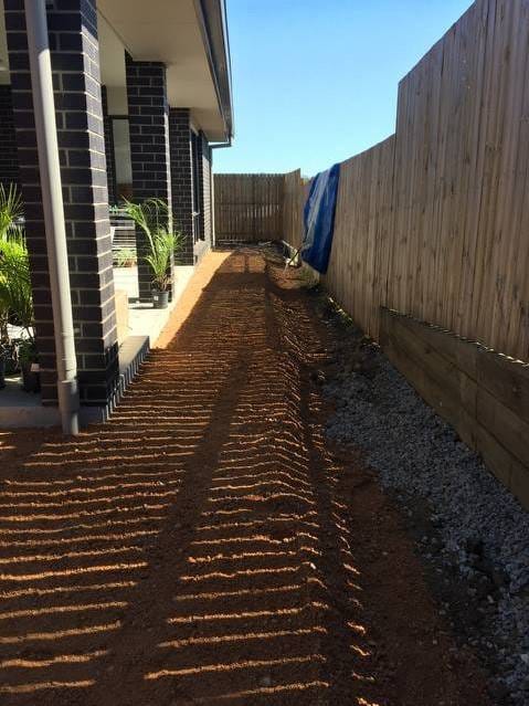 Elevated and leveled this houses surroundings in preparation for astro turf with a neat deep edge for garden installation