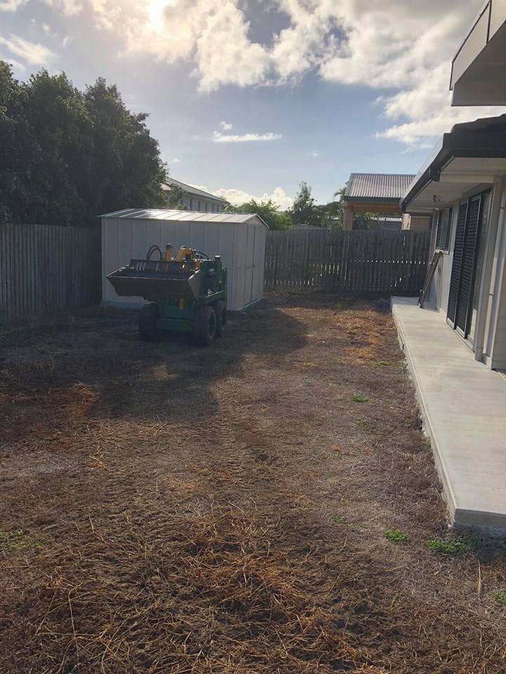 Ian Rogers hard at work and still smiling cleared out the whole backyard ready for some landscape renovations