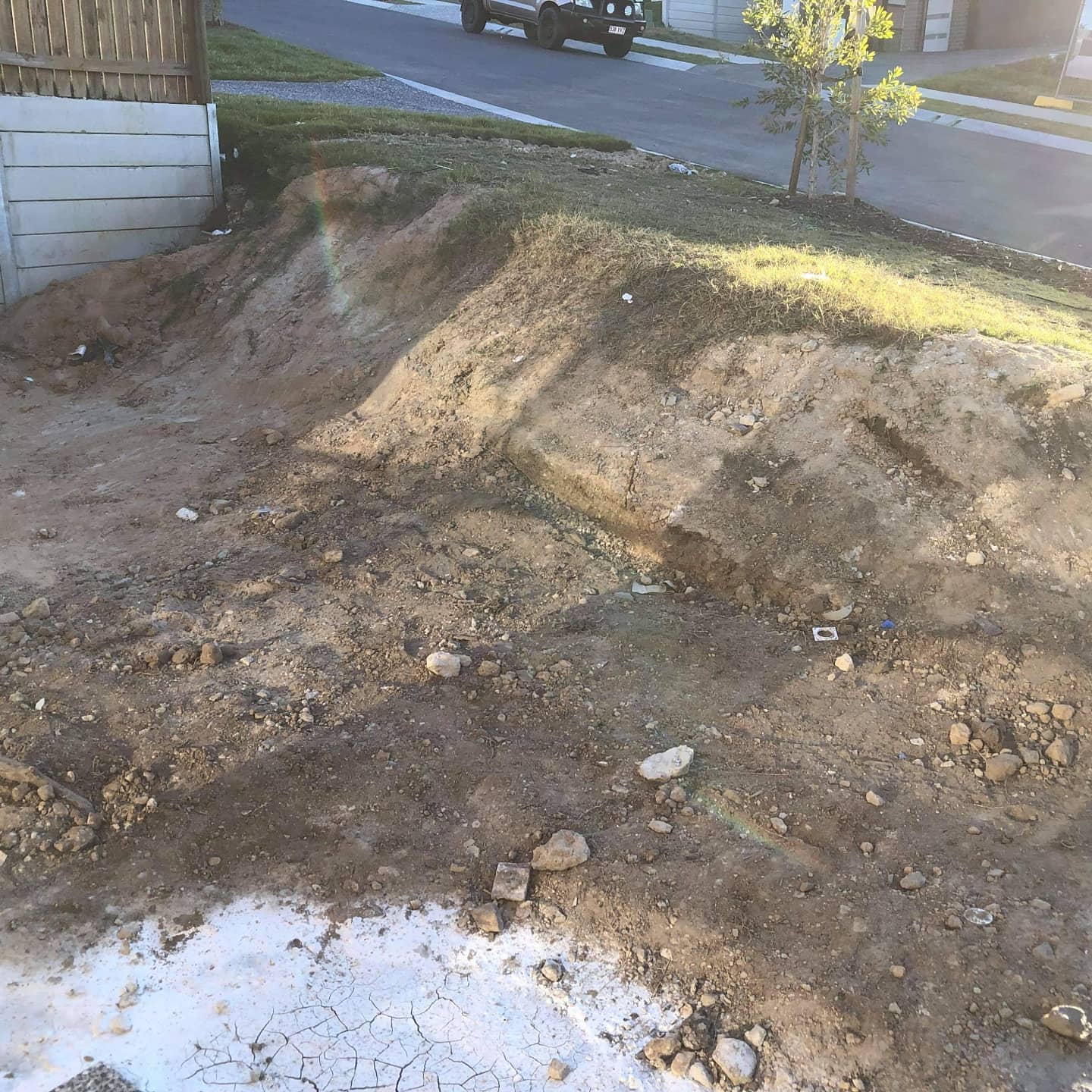 Double tier retaining wall and steps.