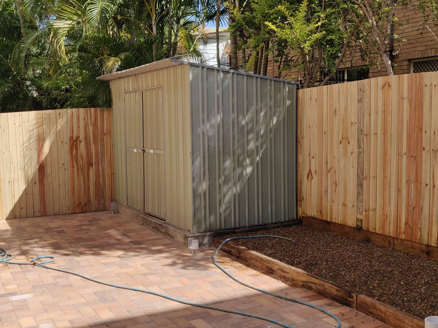 Courtyard paving and boundary fencing in East Brisbane 