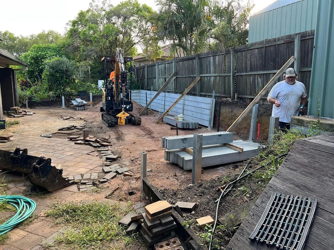 Large dig out, concrete retaining wall and colourbond fencing