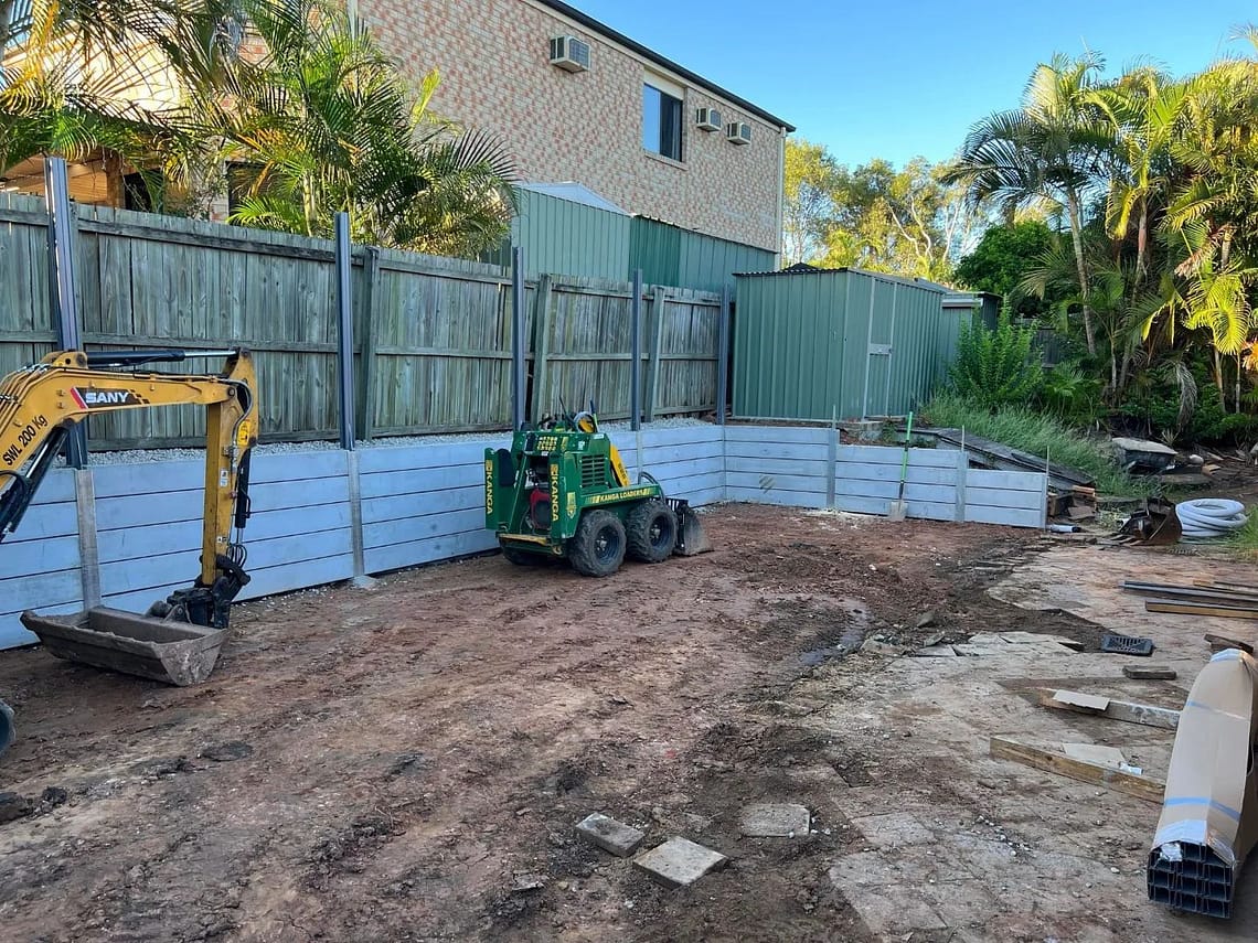 Large dig out, concrete retaining wall and colourbond fencing