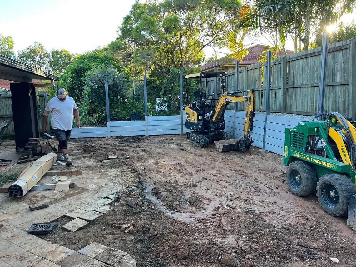 Large dig-out, concrete retaining wall and colourbond fencing