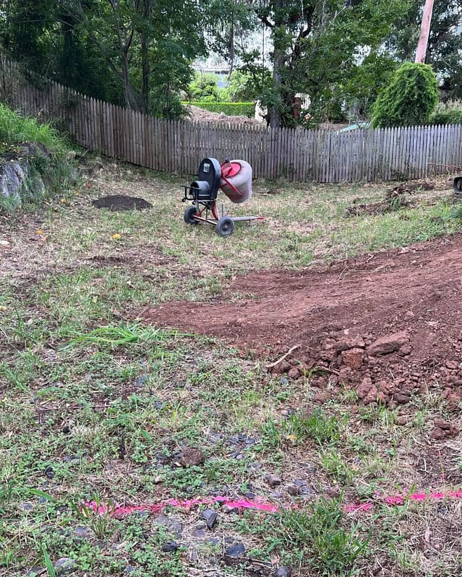 An additional 60t of fill compacted in layers was added then 100mm of quality underturf soil levelled finished with a premium buffalo palmetto