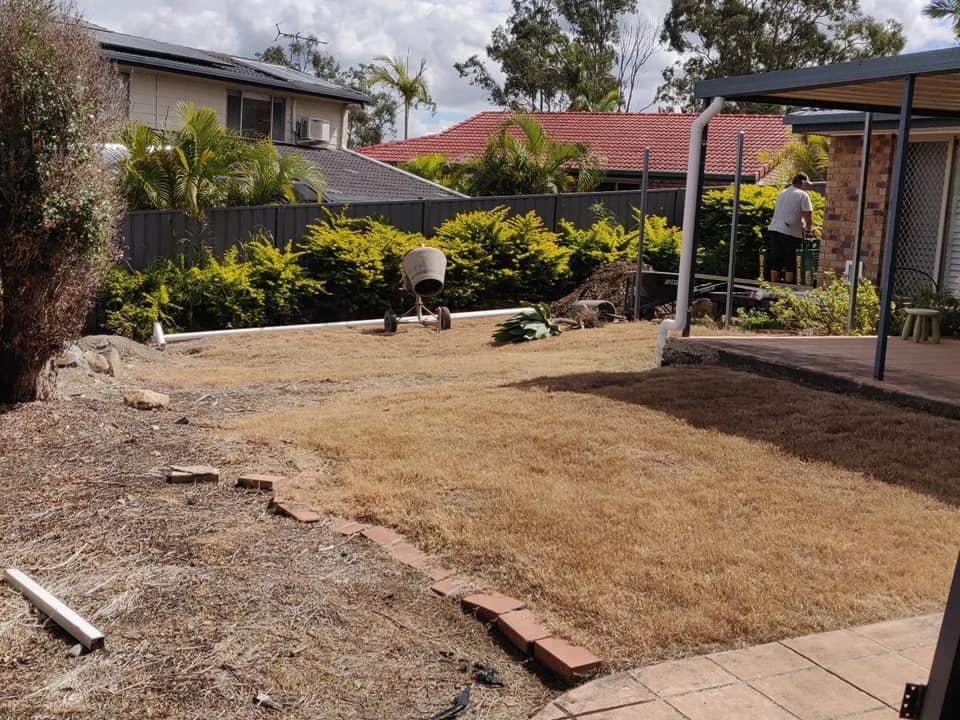 Simple backyard redo with new turf, garden beds, concrete